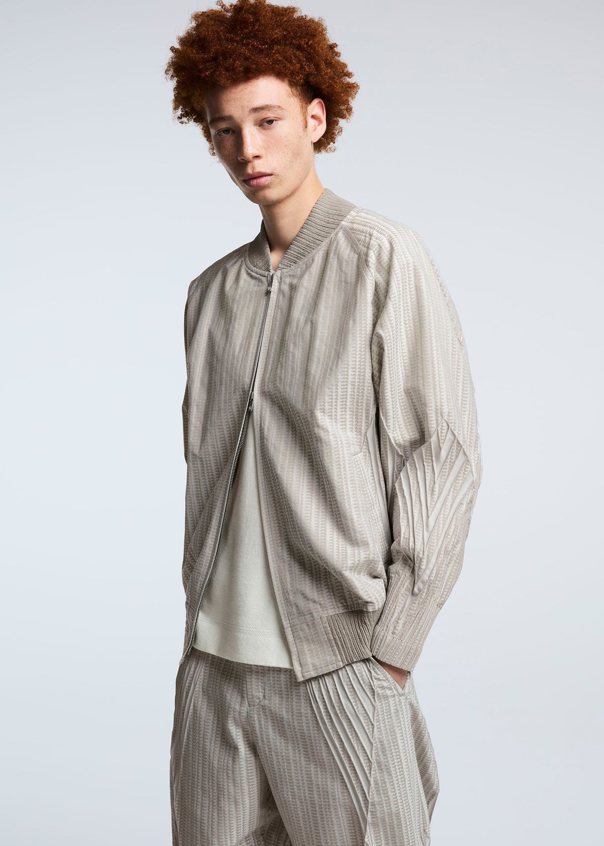 A model wears the A-POC ABLE ISSEY MIYAKE TYPE S 001 2 trousers.