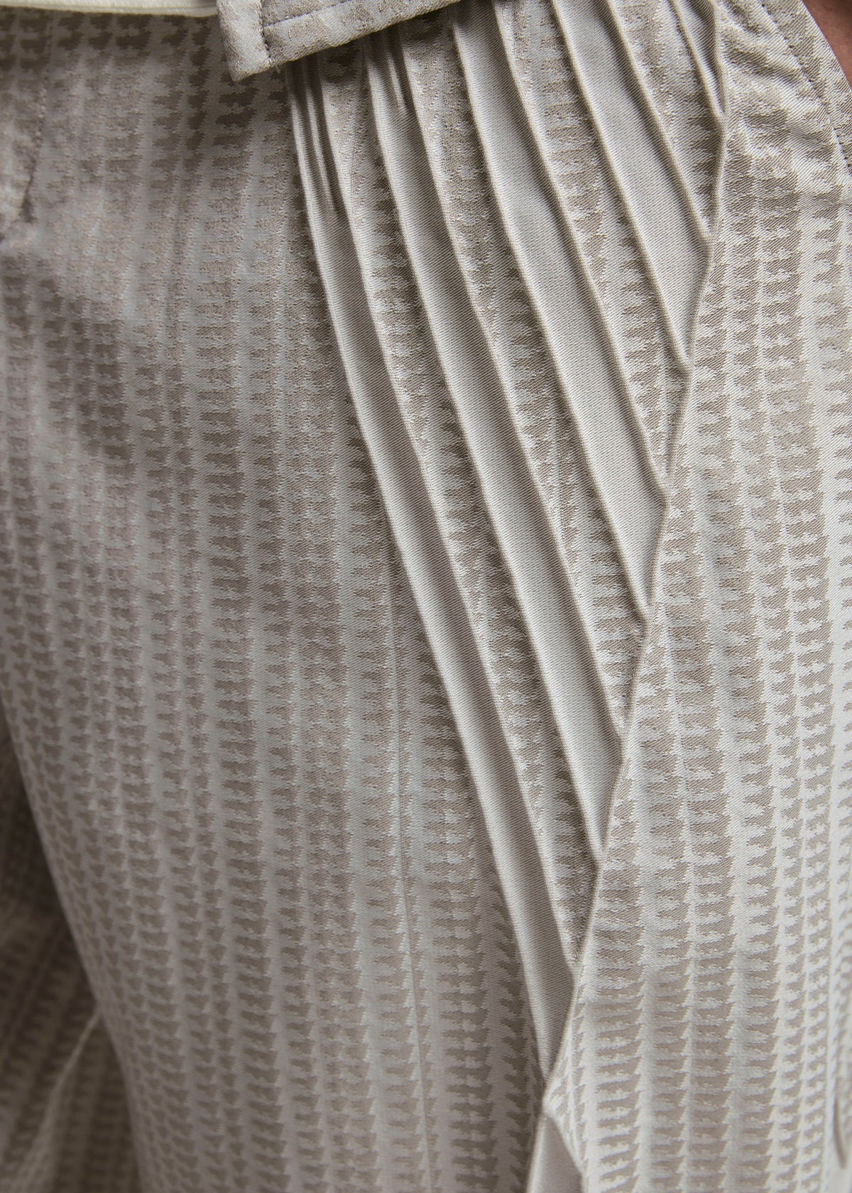 A model wears the A-POC ABLE ISSEY MIYAKE TYPE S 001 2 trousers.