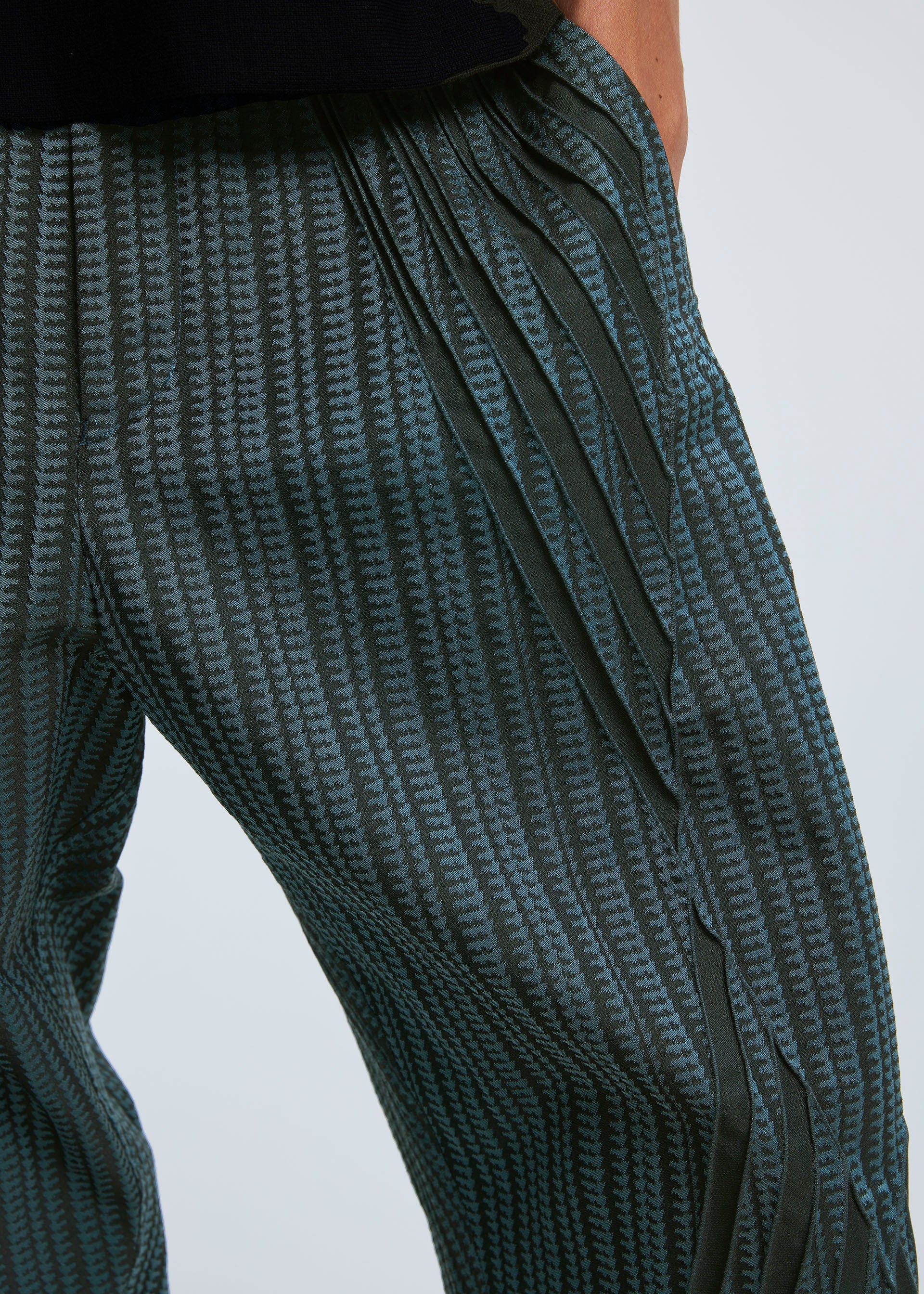 A model wears the A-POC ABLE ISSEY MIYAKE TYPE S 001 2 trousers.