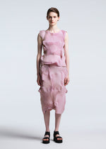 A model wears the A-POC ABLE ISSEY MIYAKE TYPE O 003 skirt.