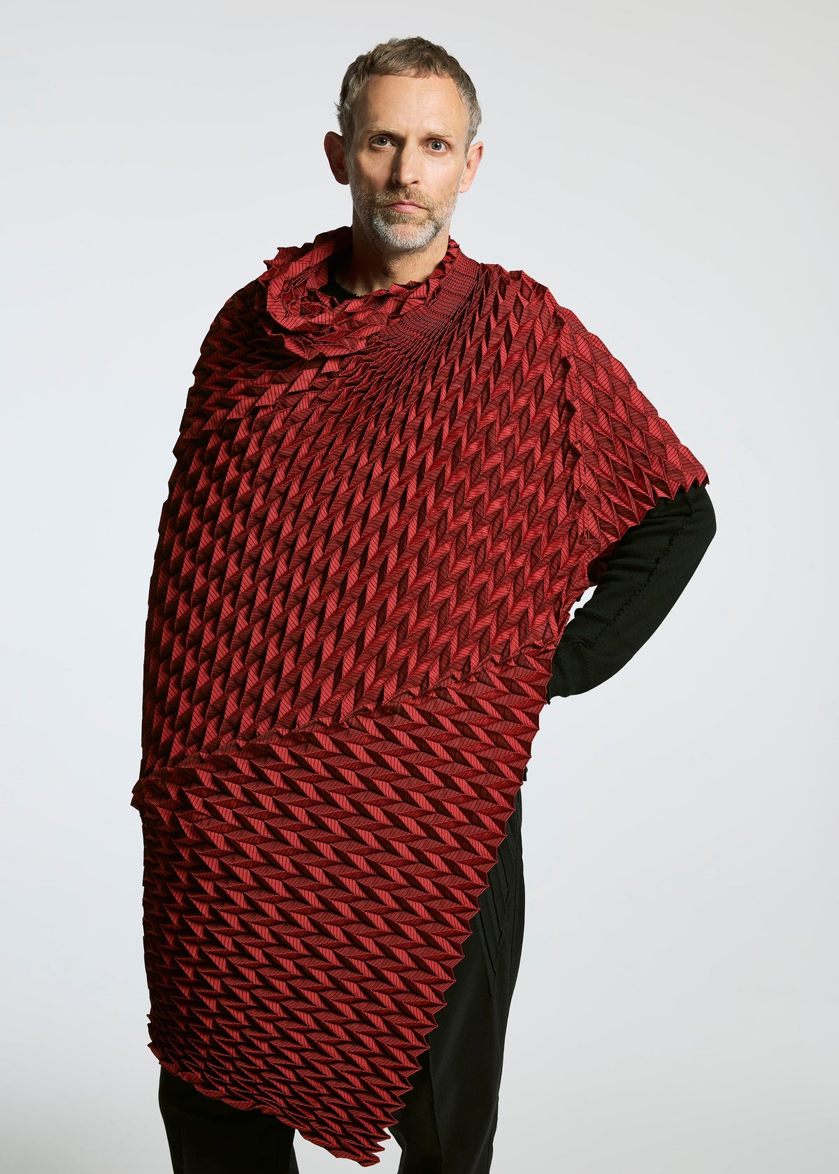 A model wears the A-POC ABLE ISSEY MIYAKE TYPE O STOLE accessories.