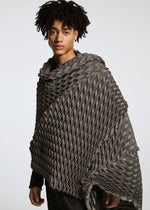 A model wears the A-POC ABLE ISSEY MIYAKE TYPE O STOLE accessories.