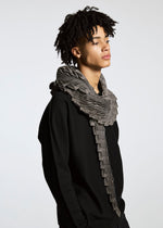 A model wears the A-POC ABLE ISSEY MIYAKE TYPE O STOLE accessories.