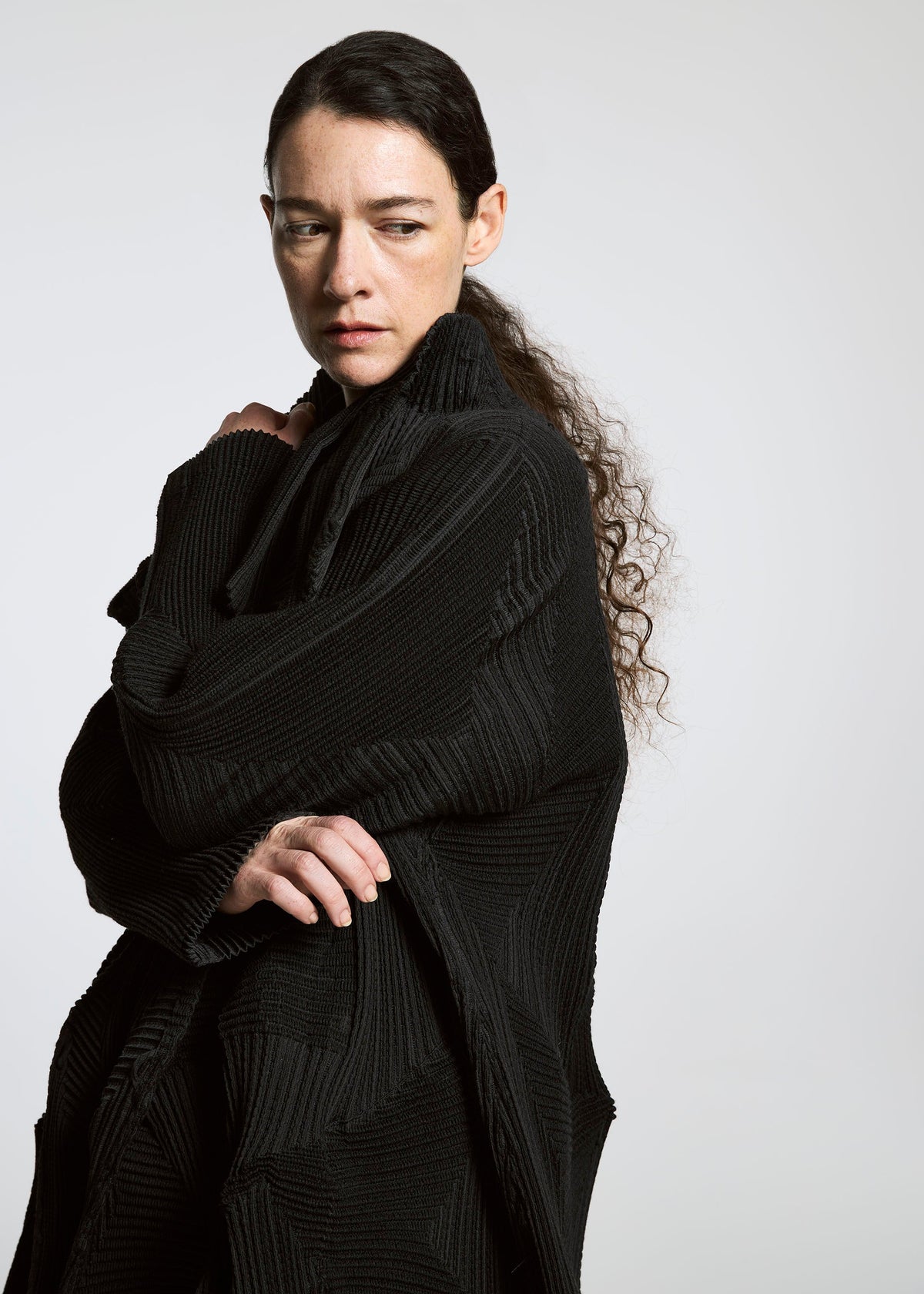 A model wears the A-POC ABLE ISSEY MIYAKE TYPE O 020 coat.