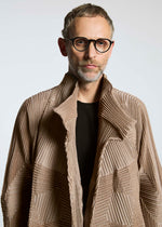 A model wears the A-POC ABLE ISSEY MIYAKE TYPE O 020 coat.