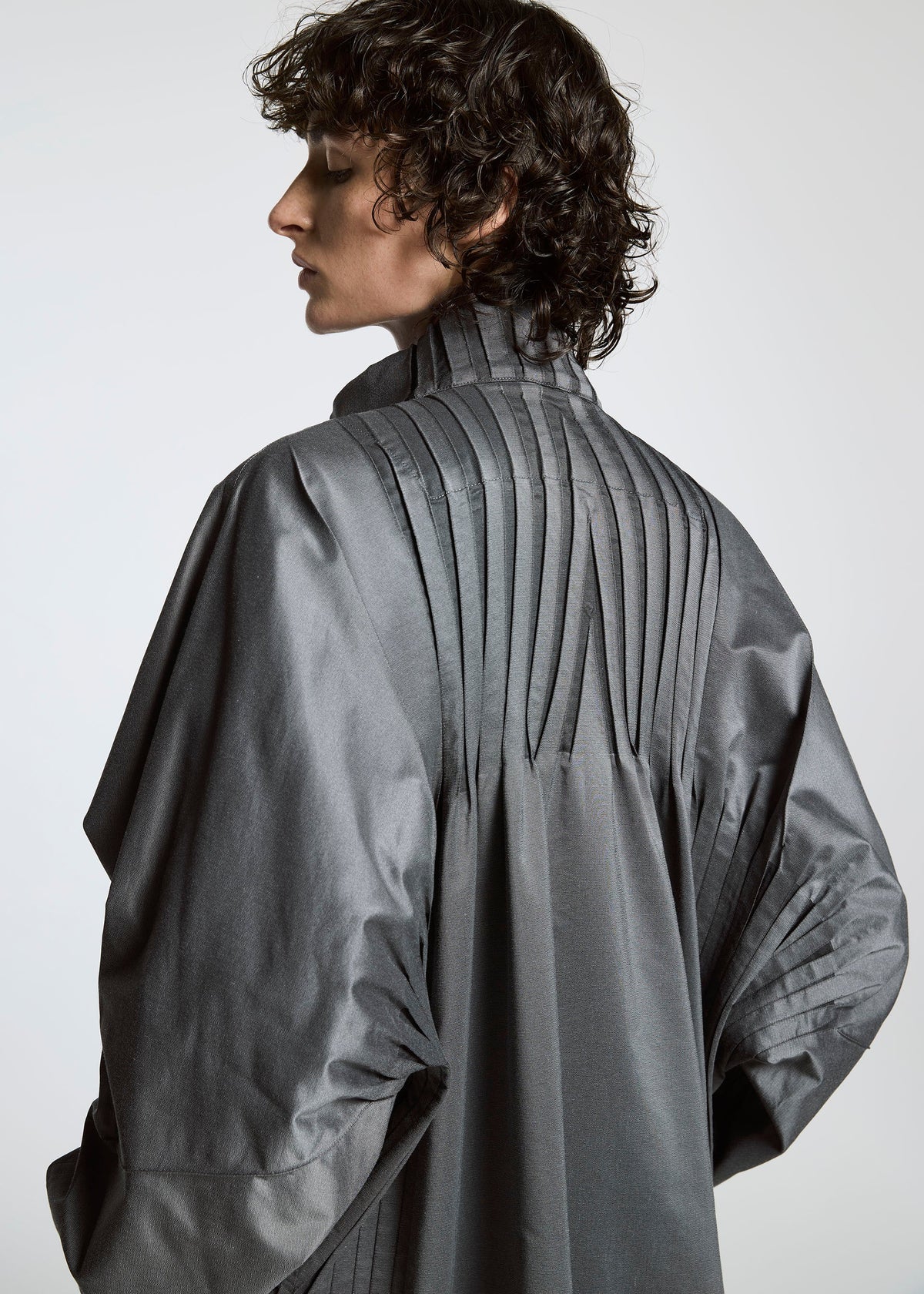 A model wears the A-POC ABLE ISSEY MIYAKE TYPE S 001 1 coat.