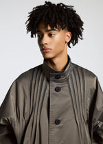 A model wears the A-POC ABLE ISSEY MIYAKE TYPE S 001 1 coat.