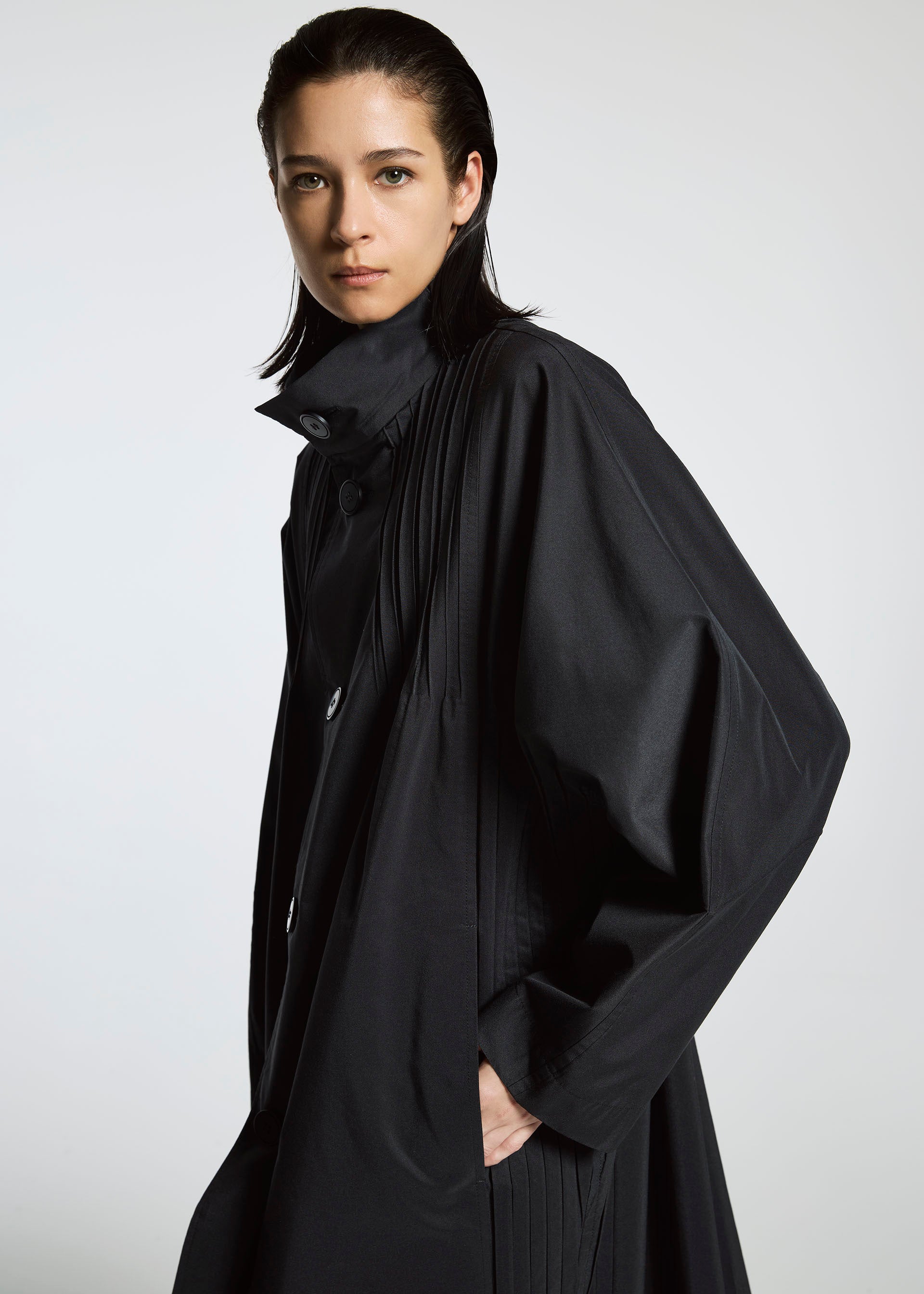 A model wears the A-POC ABLE ISSEY MIYAKE TYPE S 001 1 coat.