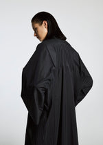 A model wears the A-POC ABLE ISSEY MIYAKE TYPE S 001 1 coat.