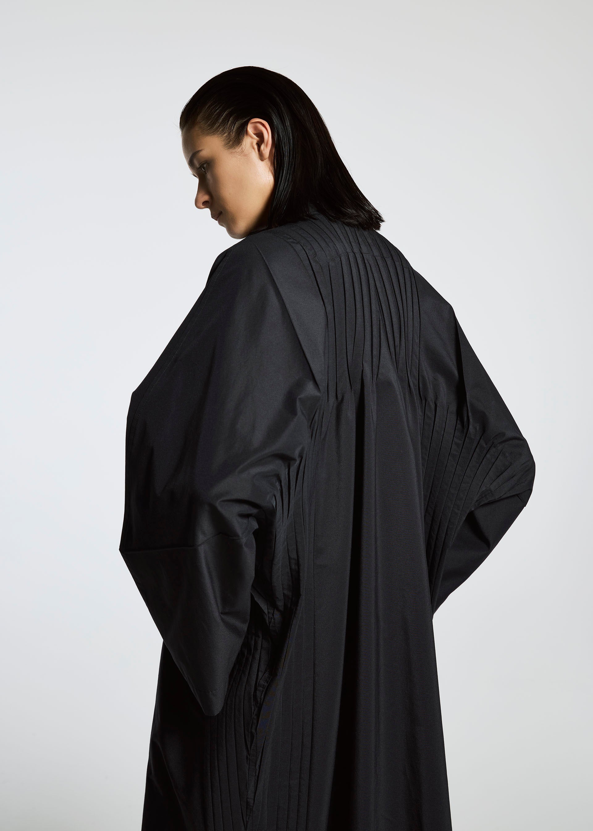 A model wears the A-POC ABLE ISSEY MIYAKE TYPE S 001 1 coat.