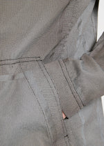 A model wears the A-POC ABLE ISSEY MIYAKE TYPE U 001 jacket.