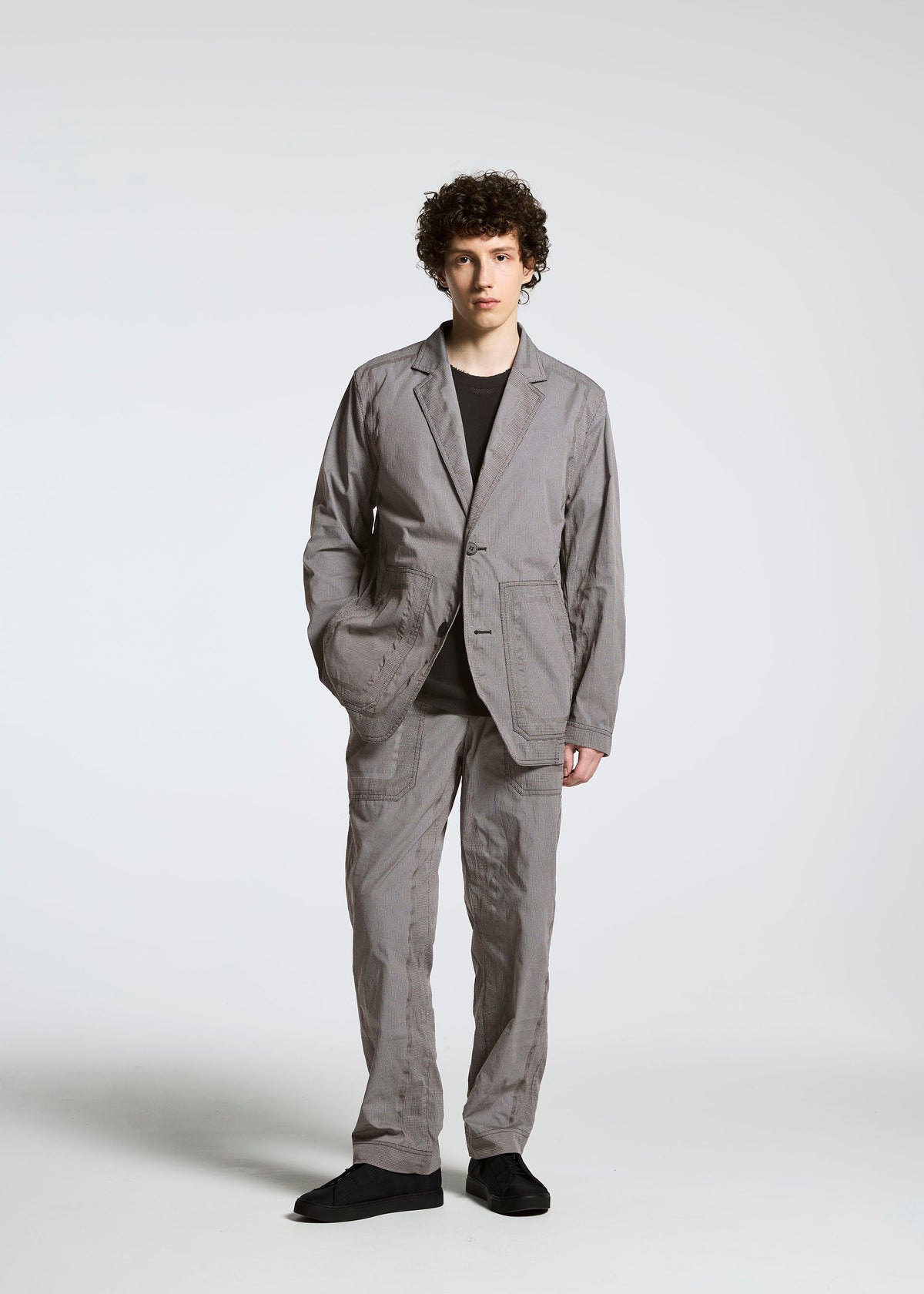 A model wears the A-POC ABLE ISSEY MIYAKE TYPE U 001 trousers.