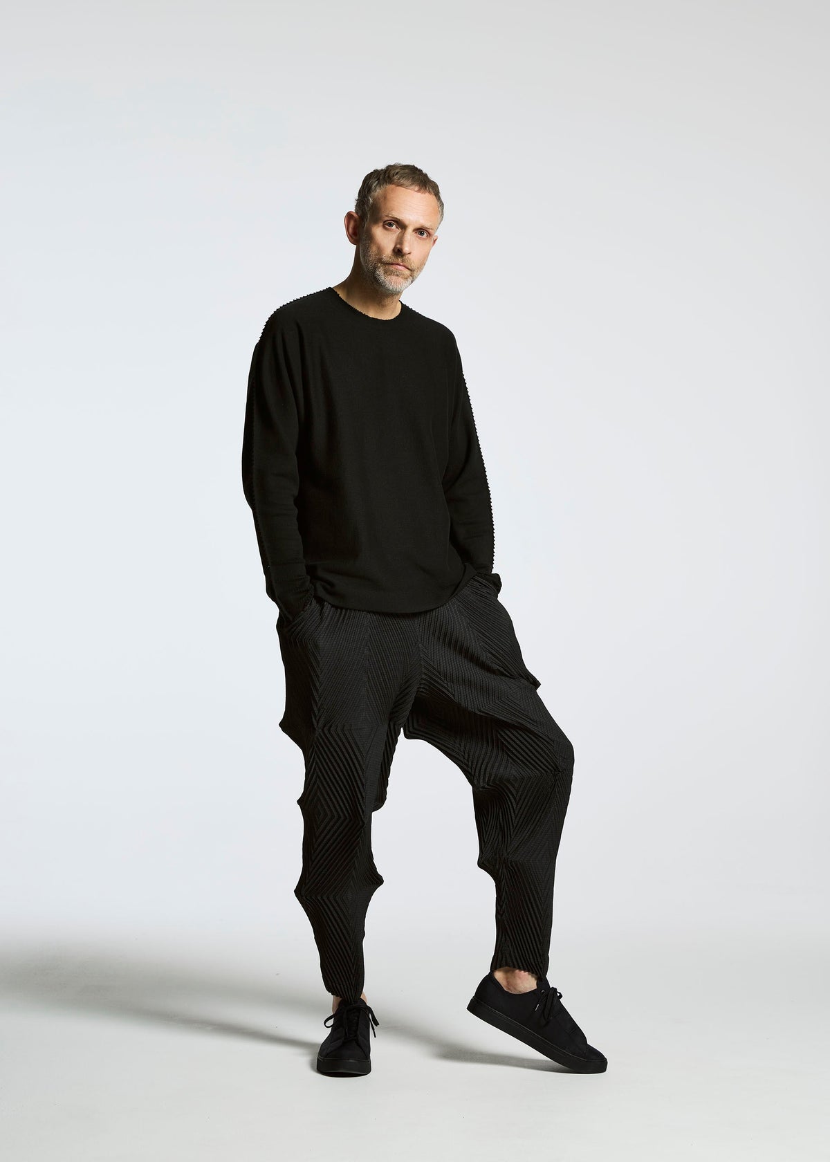 A model wears the A-POC ABLE ISSEY MIYAKE TYPE O 007 trousers.