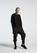 A model wears the A-POC ABLE ISSEY MIYAKE TYPE O 007 trousers.