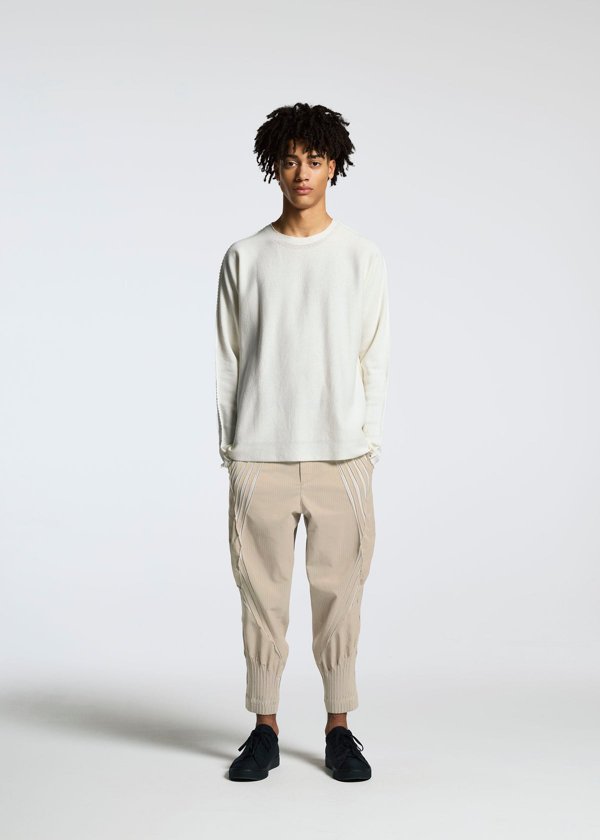 A model wears the A-POC ABLE ISSEY MIYAKE TYPE S 001 3 trousers.