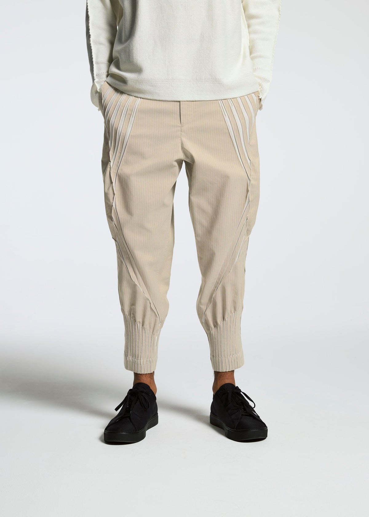 A model wears the A-POC ABLE ISSEY MIYAKE TYPE S 001 3 trousers.