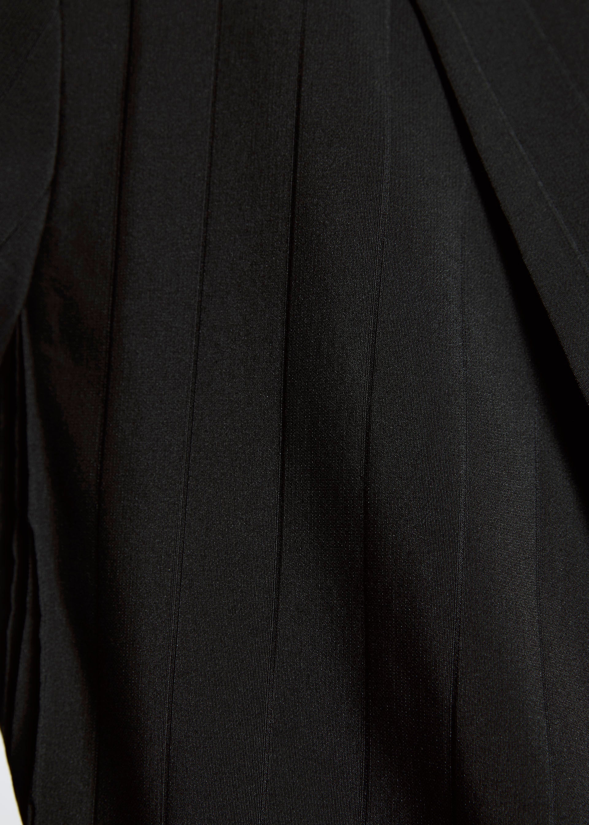 A model wears the A-POC ABLE ISSEY MIYAKE TYPE I 007 trousers.