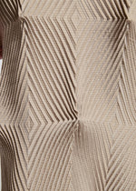 A model wears the A-POC ABLE ISSEY MIYAKE TYPE O 007 dress.