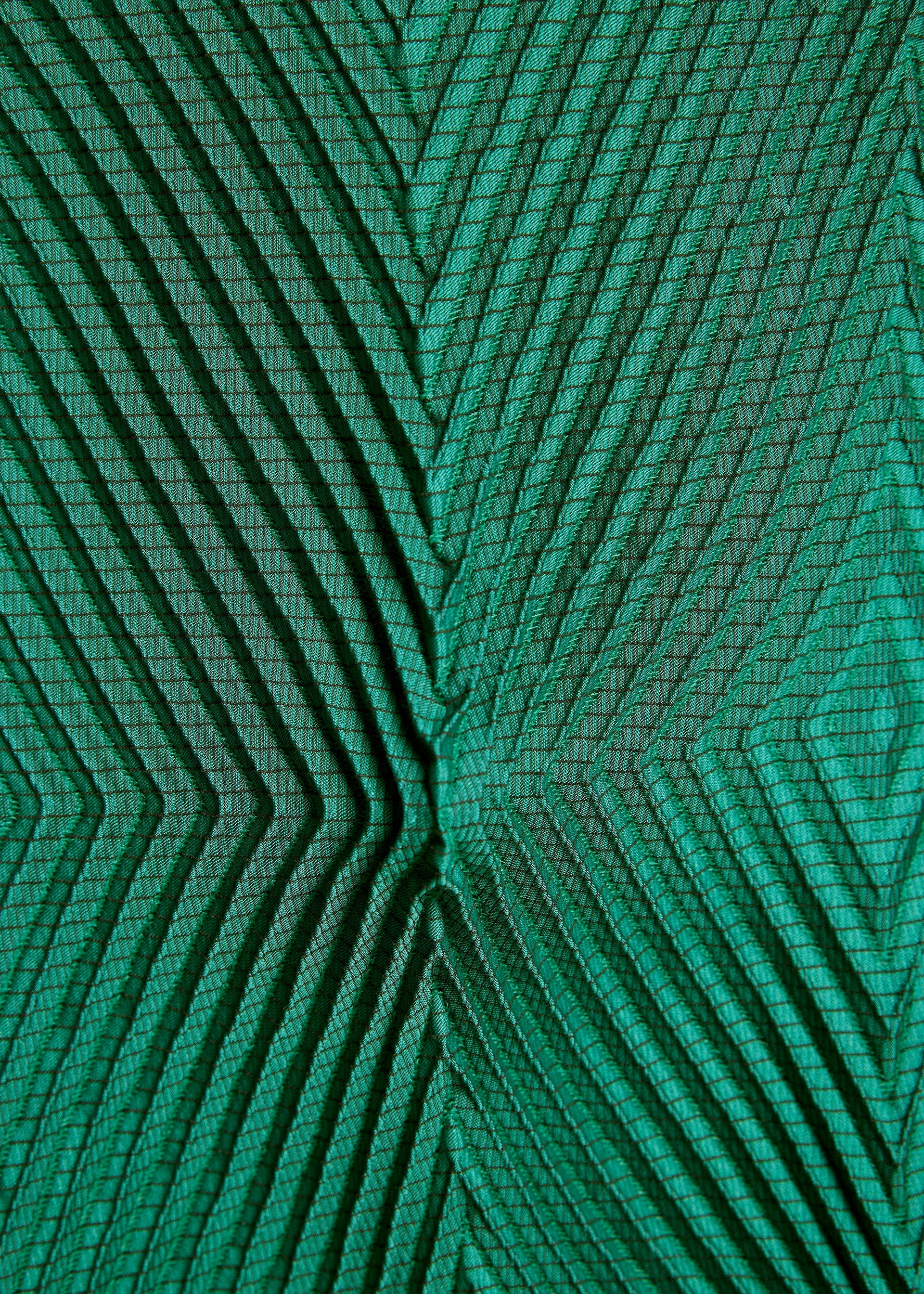 A model wears the A-POC ABLE ISSEY MIYAKE TYPE O 007 dress.