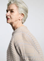 A model wears the A-POC ABLE ISSEY MIYAKE TYPE W 010 clothing.