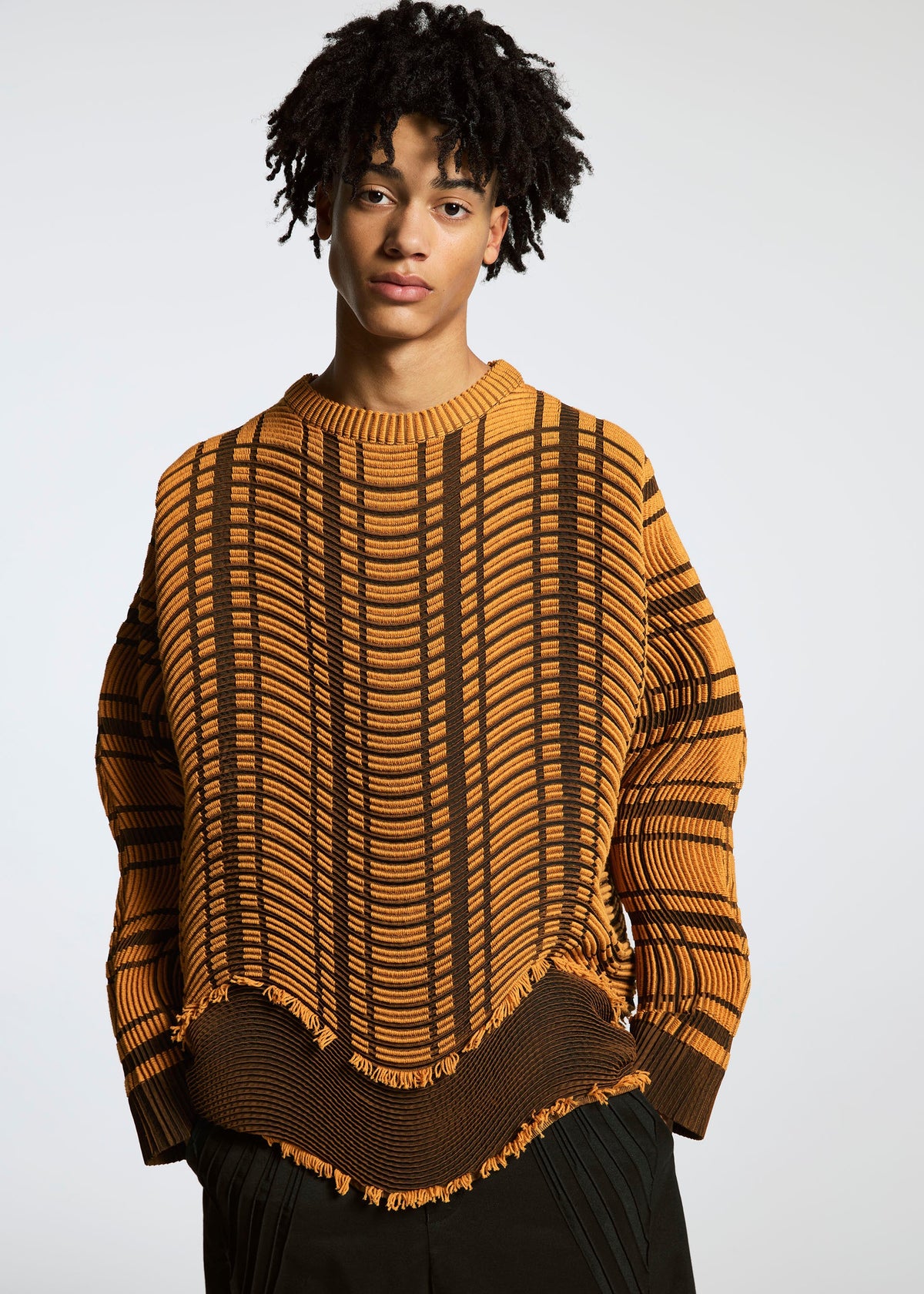 A model wears the A-POC ABLE ISSEY MIYAKE TYPE W 010 clothing.