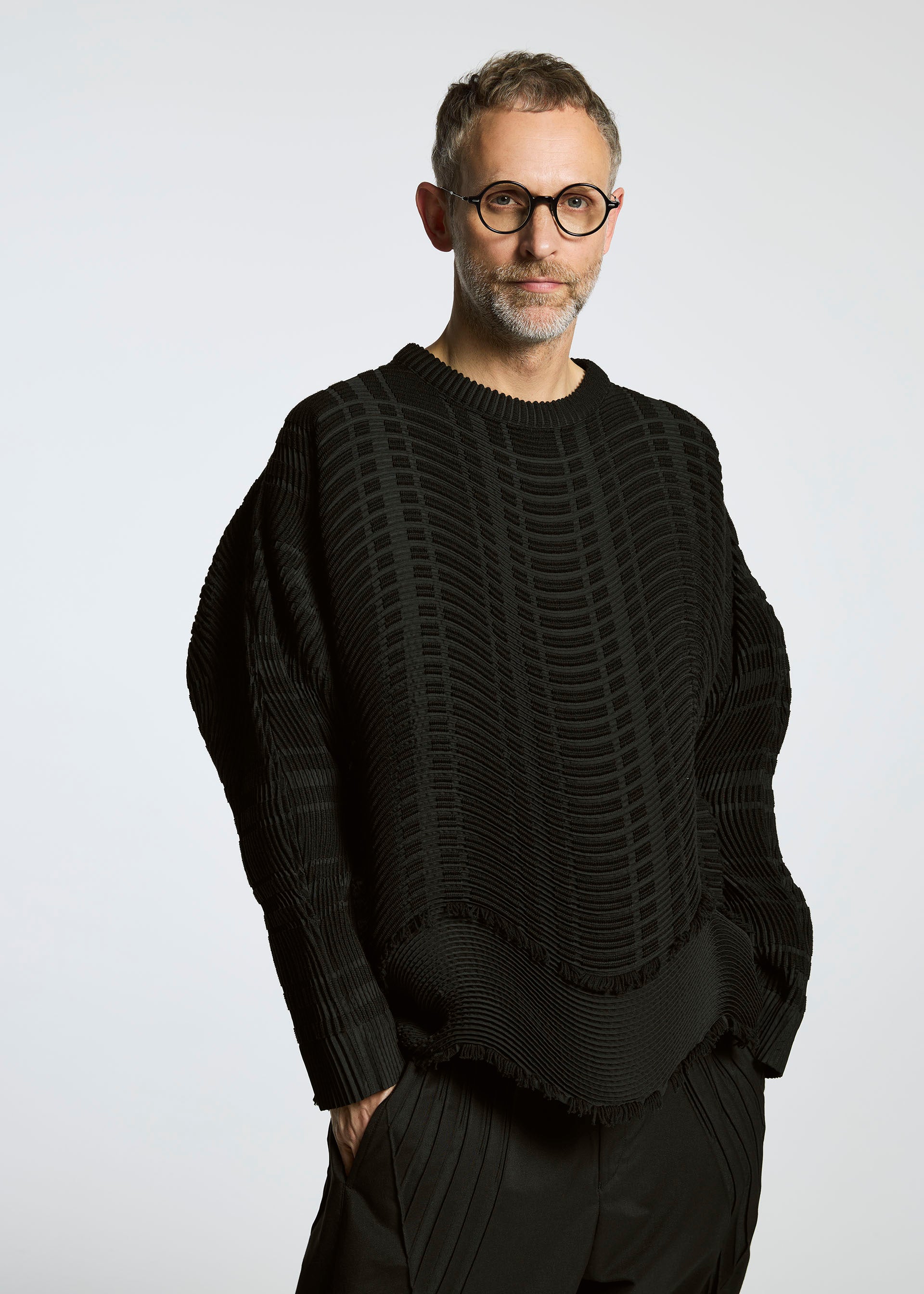 A model wears the A-POC ABLE ISSEY MIYAKE TYPE W 010 clothing.