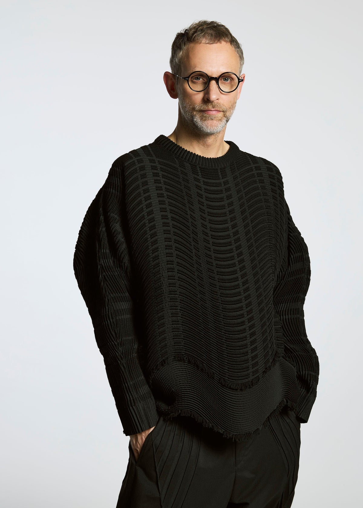 A model wears the A-POC ABLE ISSEY MIYAKE TYPE W 010 clothing.