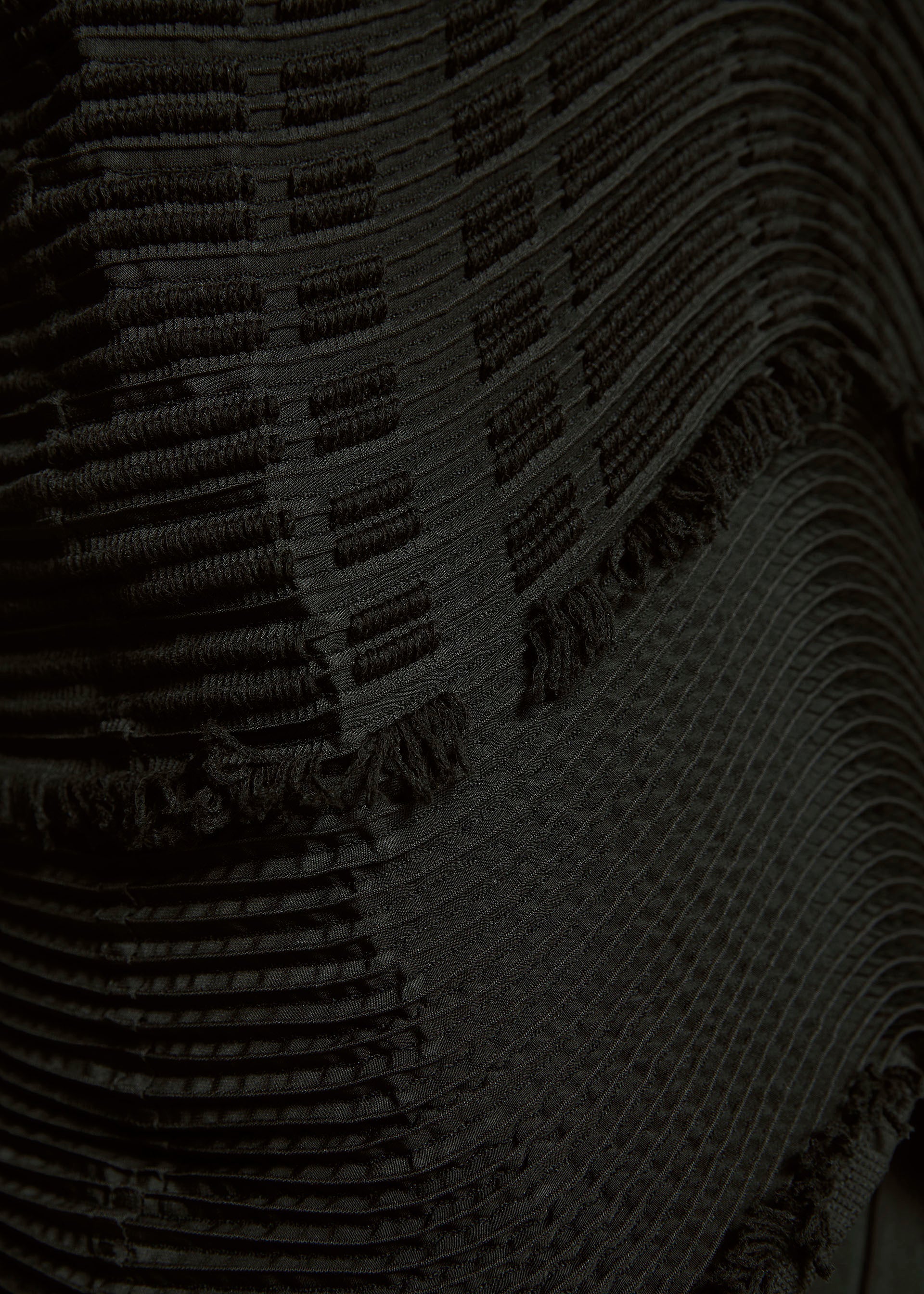 A model wears the A-POC ABLE ISSEY MIYAKE TYPE W 010 clothing.