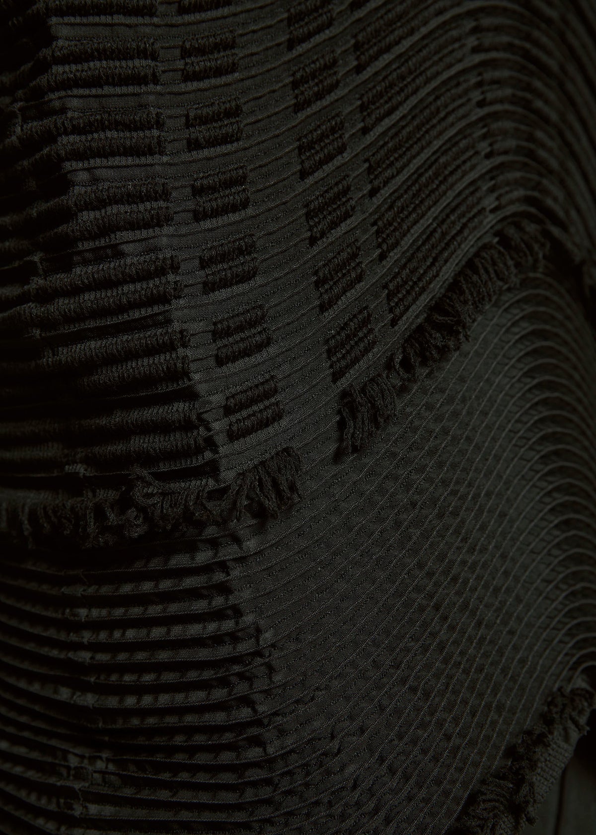 A model wears the A-POC ABLE ISSEY MIYAKE TYPE W 010 clothing.