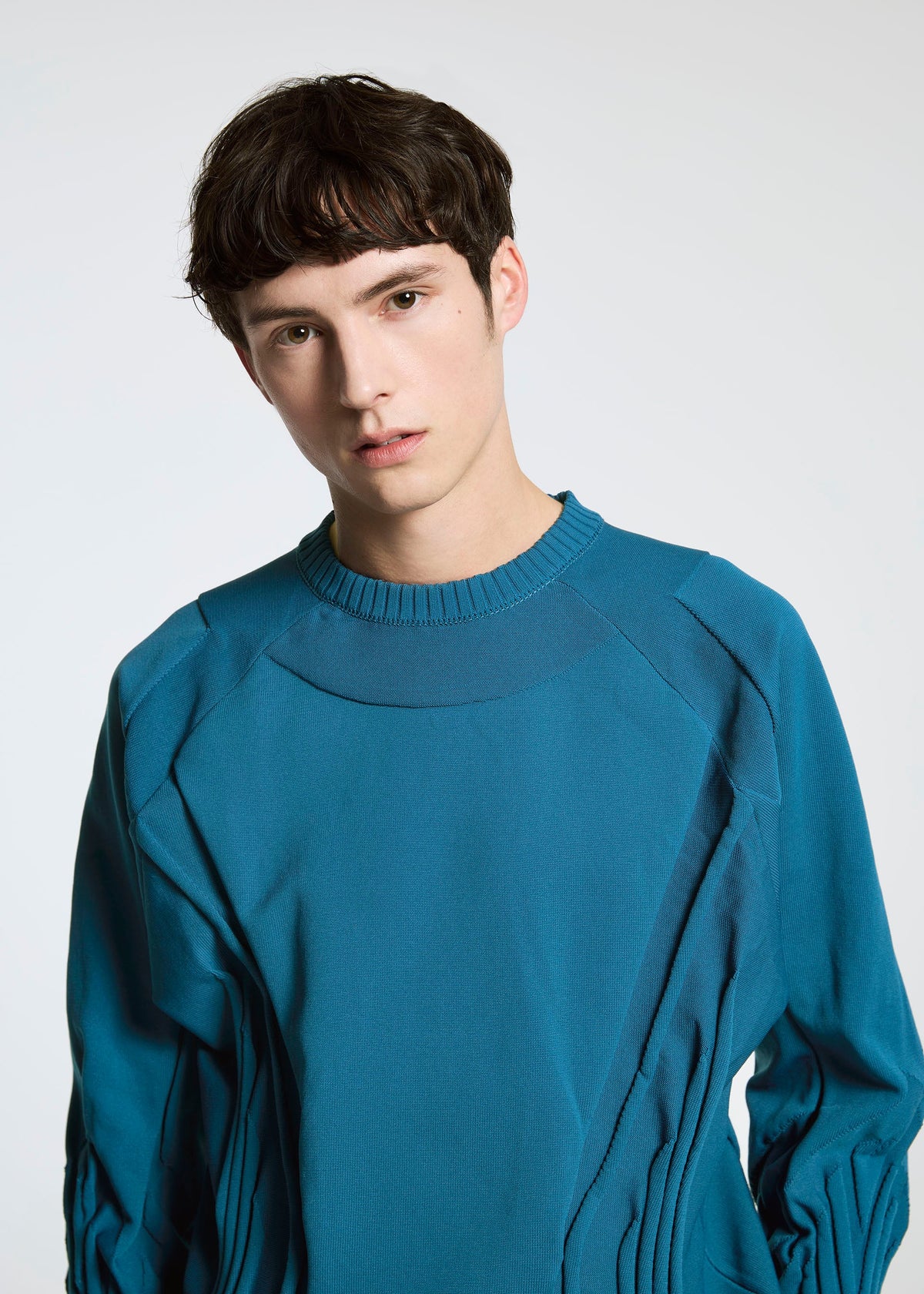 A model wears the A-POC ABLE ISSEY MIYAKE TYPE K 001 top.