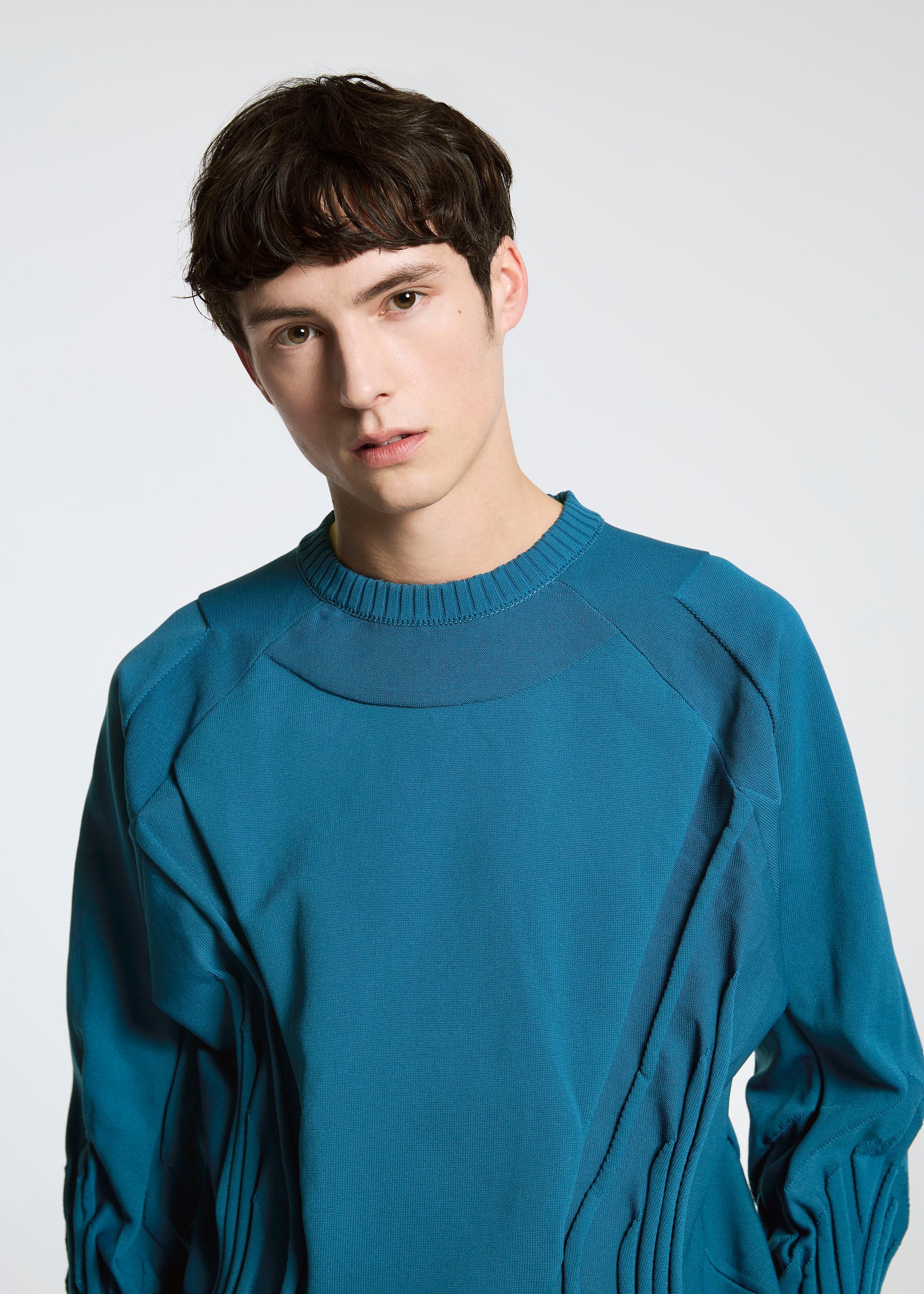 A model wears the A-POC ABLE ISSEY MIYAKE TYPE K 001 top.