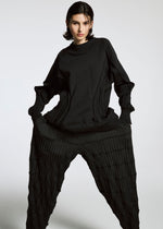 A model wears the A-POC ABLE ISSEY MIYAKE TYPE K 001 top.