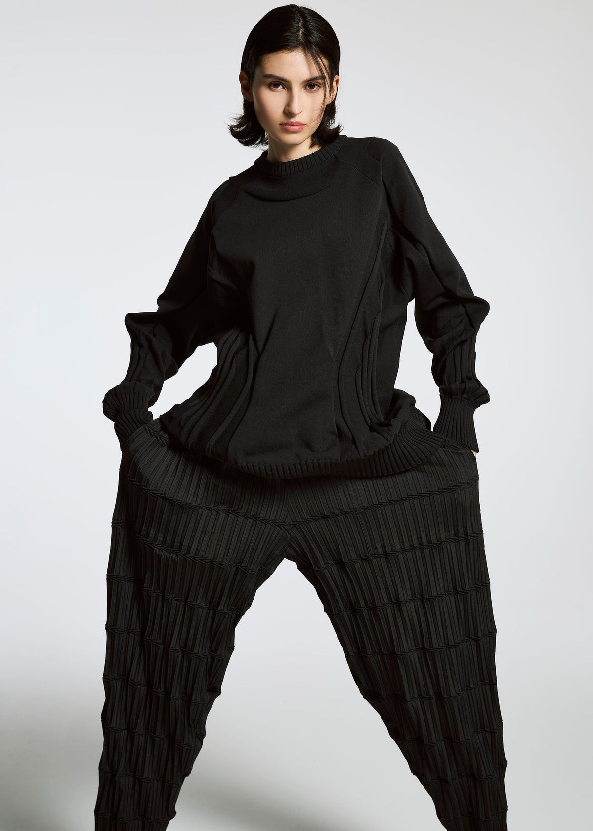 A model wears the A-POC ABLE ISSEY MIYAKE TYPE K 001 top.