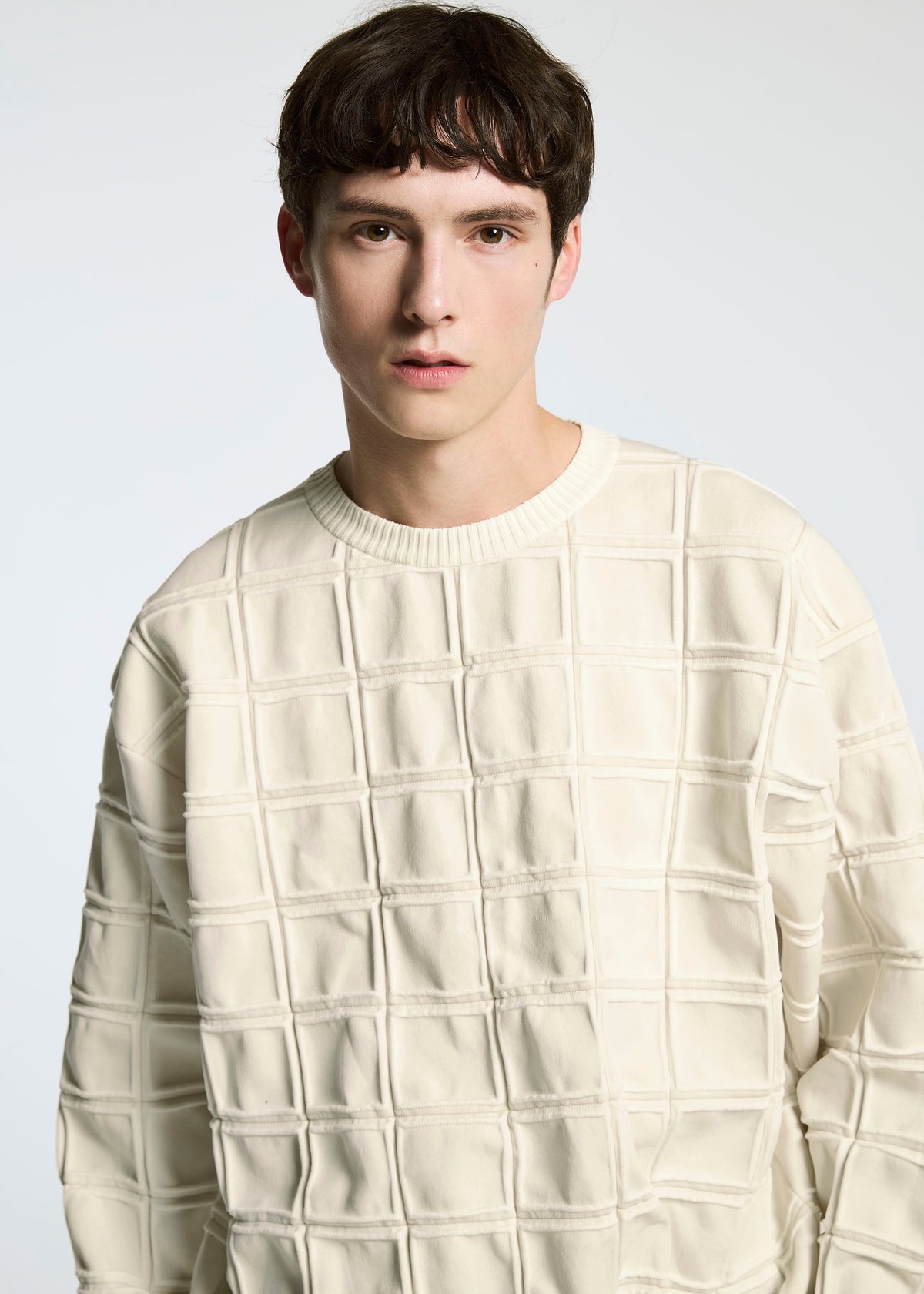 A model wears the A-POC ABLE ISSEY MIYAKE TYPE K 006 top.