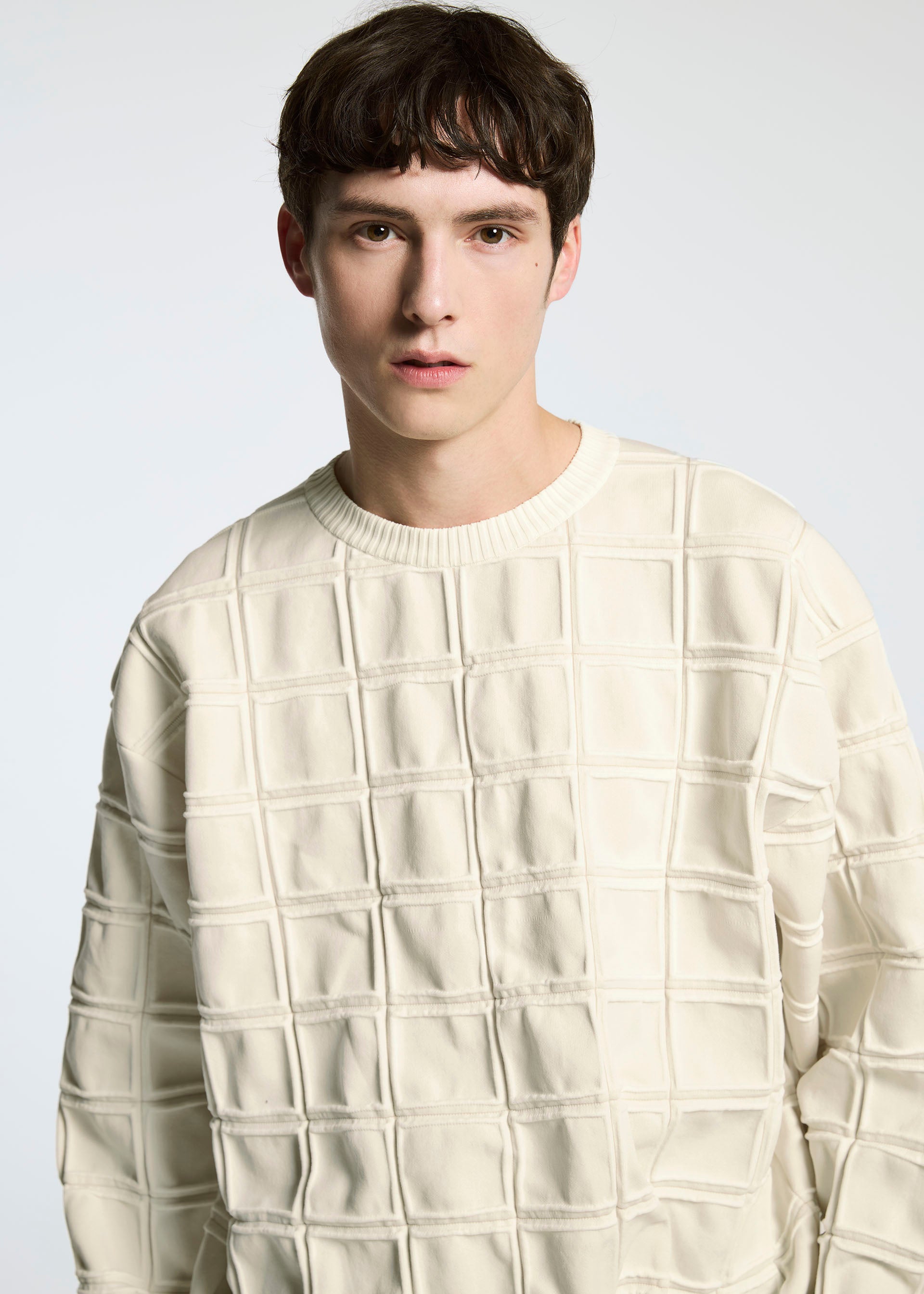 A model wears the A-POC ABLE ISSEY MIYAKE TYPE K 006 top.