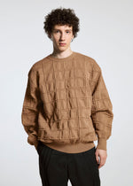 A model wears the A-POC ABLE ISSEY MIYAKE TYPE K 006 top.