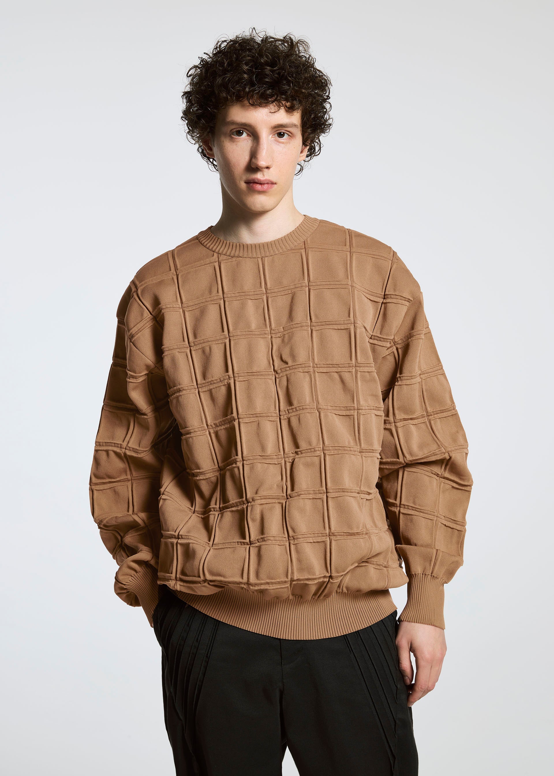 A model wears the A-POC ABLE ISSEY MIYAKE TYPE K 006 top.