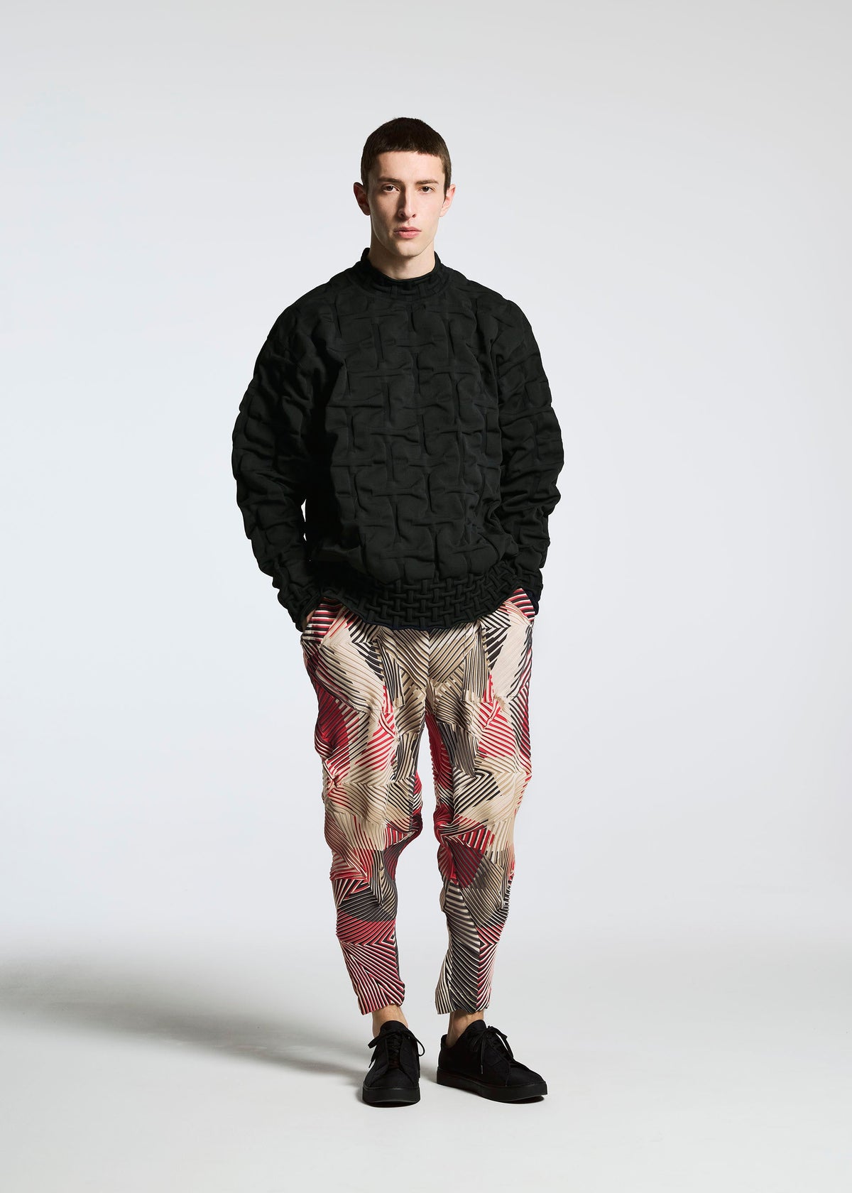 A model wears the A-POC ABLE ISSEY MIYAKE TYPE K 007 clothing.