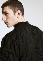 A model wears the A-POC ABLE ISSEY MIYAKE TYPE K 007 clothing.