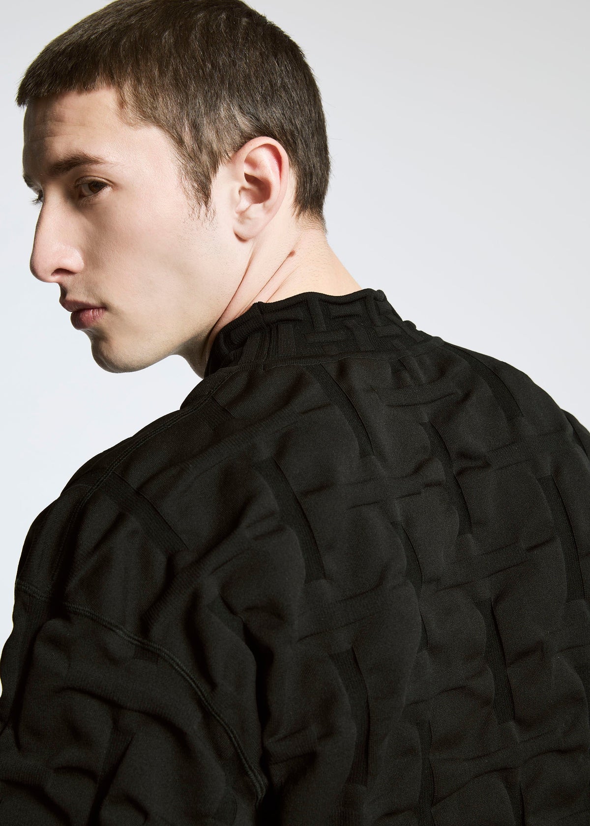 A model wears the A-POC ABLE ISSEY MIYAKE TYPE K 007 clothing.