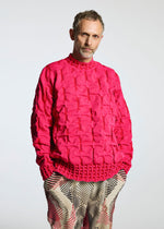A model wears the A-POC ABLE ISSEY MIYAKE TYPE K 007 clothing.