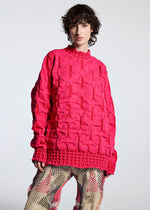 A model wears the A-POC ABLE ISSEY MIYAKE TYPE K 007 clothing.