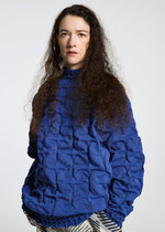 A model wears the A-POC ABLE ISSEY MIYAKE TYPE K 007 clothing.