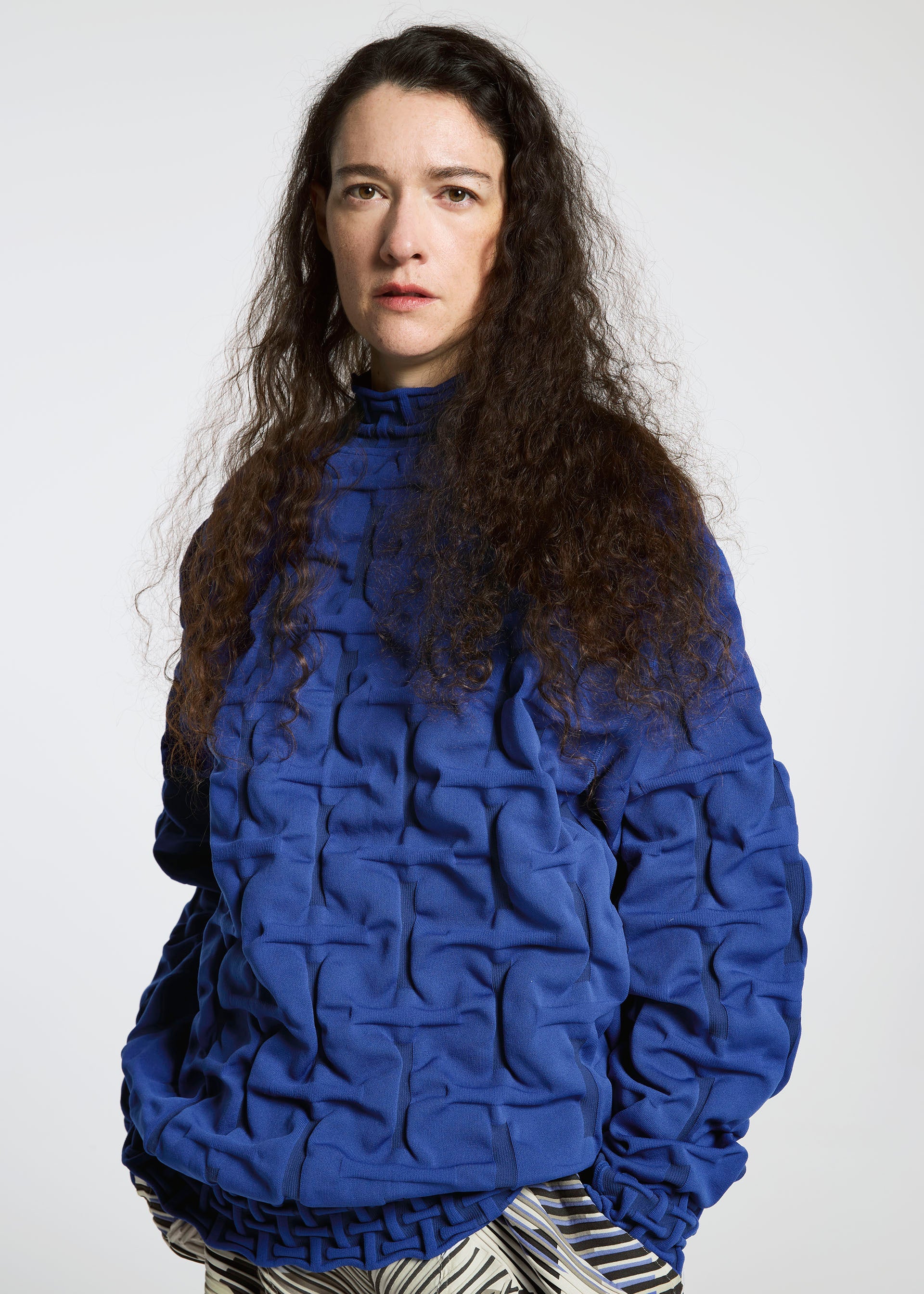 A model wears the A-POC ABLE ISSEY MIYAKE TYPE K 007 clothing.