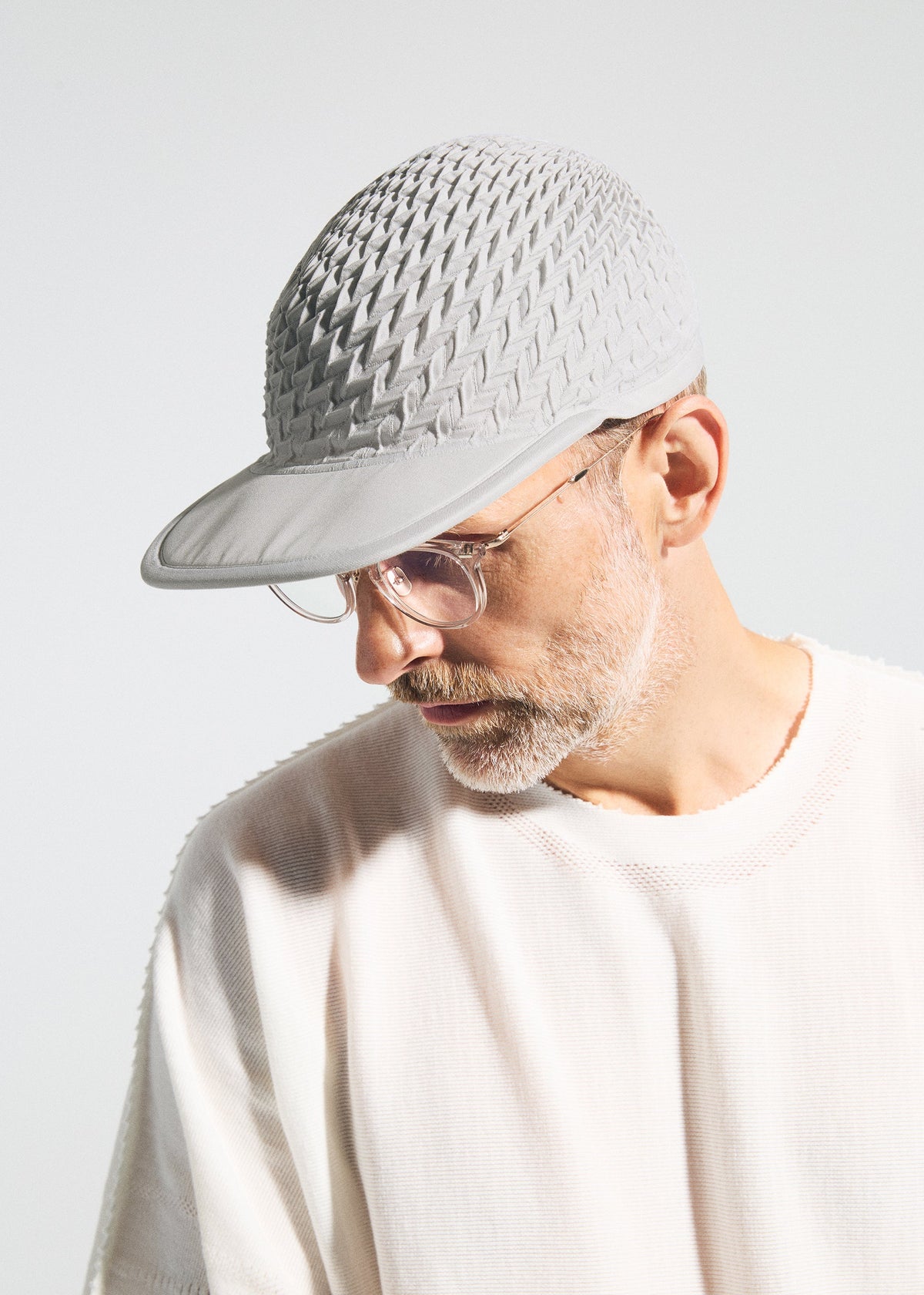 A model wears the A-POC ABLE ISSEY MIYAKE TYPE O CAP cap.