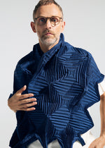 A model wears the A-POC ABLE ISSEY MIYAKE TYPE-O STOLE 002 type-o-stole-002-stole-black.