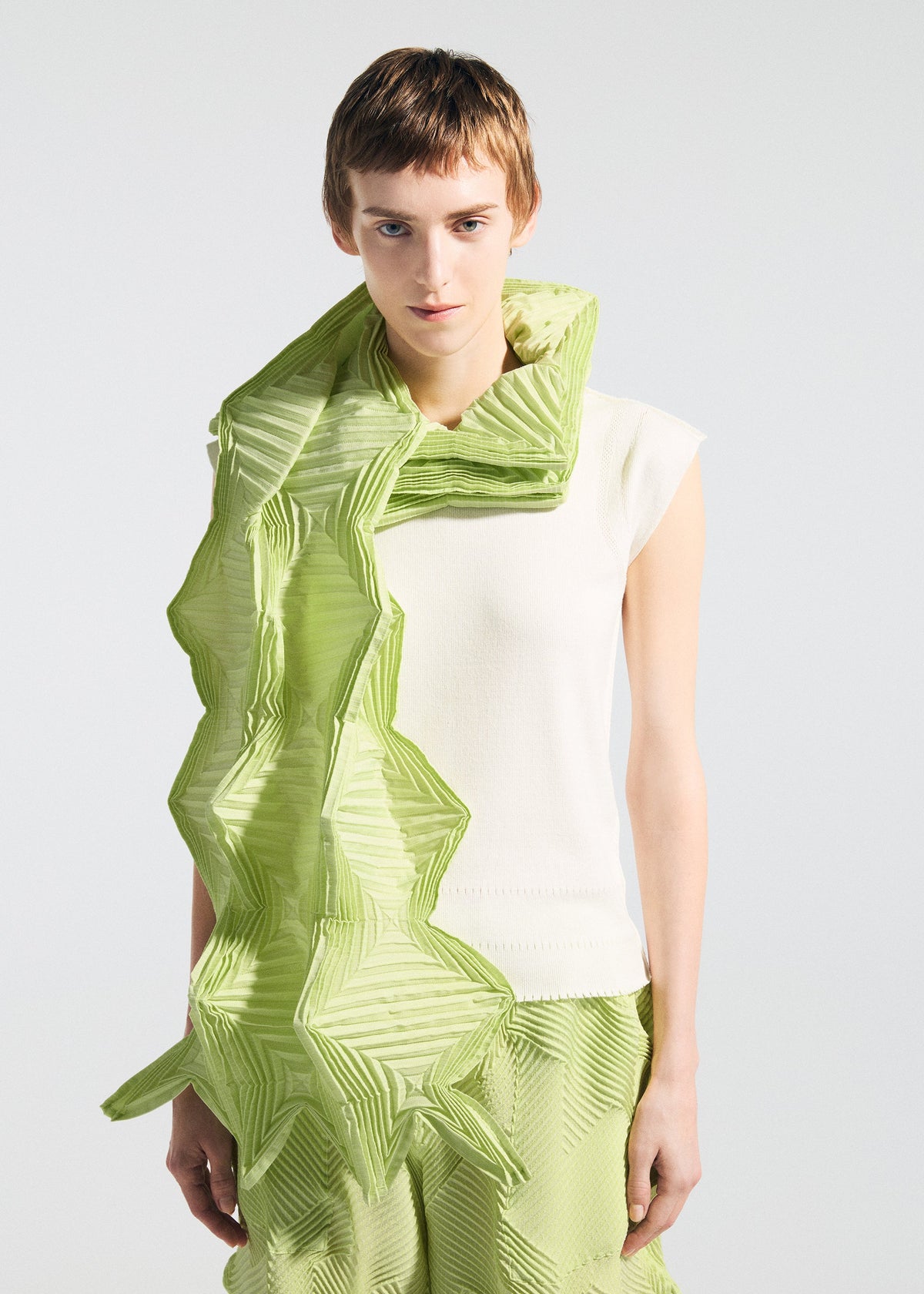 A model wears the A-POC ABLE ISSEY MIYAKE TYPE-O STOLE 002 type-o-stole-002-stole-light-green.