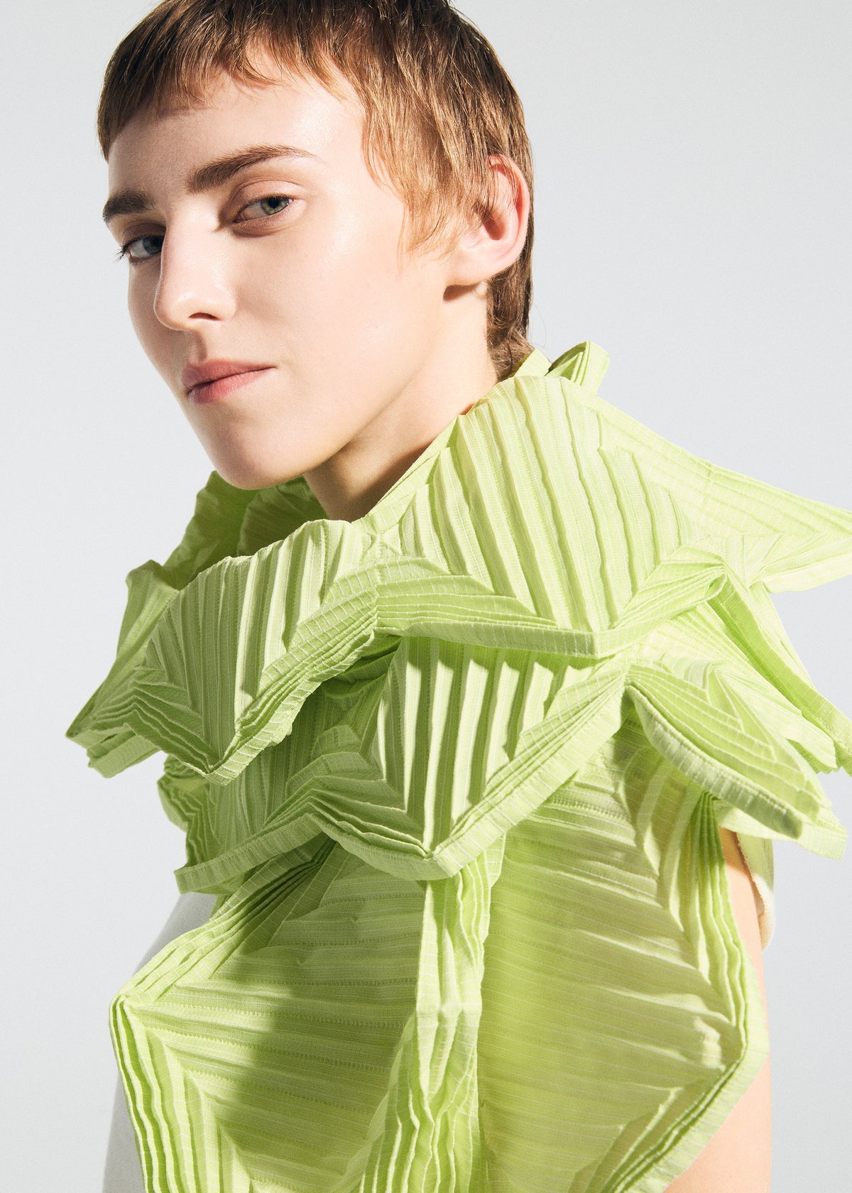 A model wears the A-POC ABLE ISSEY MIYAKE TYPE-O STOLE 002 type-o-stole-002-stole-light-green.