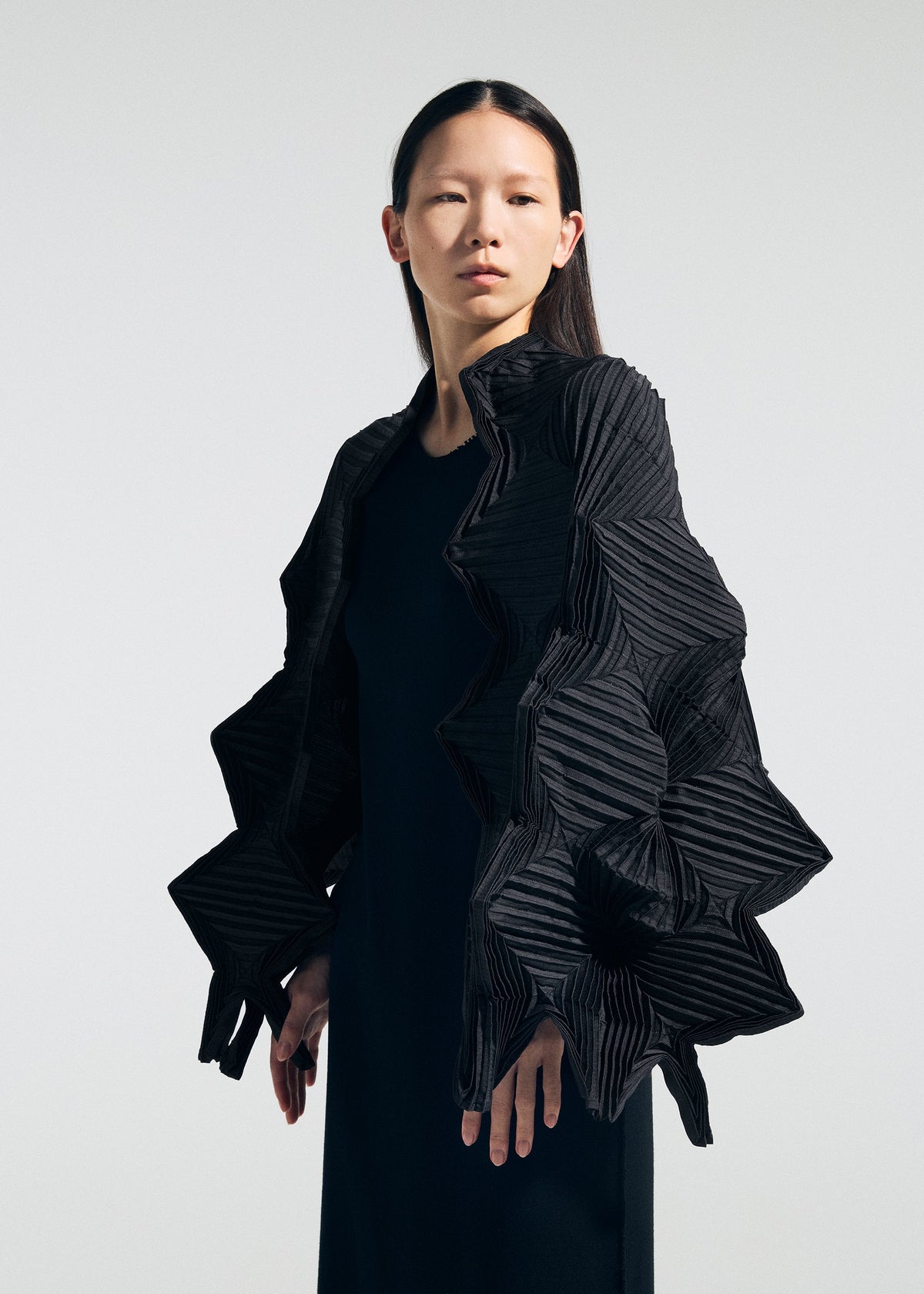A model wears the A-POC ABLE ISSEY MIYAKE TYPE-O STOLE 002 type-o-stole-002-stole-off-white.