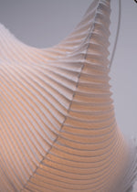 A detail shot of the A-POC ABLE ISSEY MIYAKE TYPE XIII Atelier Oï project accessory.
